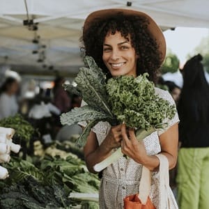 Happy person shopping at a farmers market