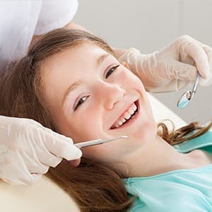 Smiling child in dental chair for children's dentistry