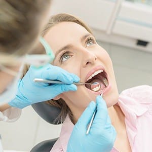 Woman receiving gum disease treatment