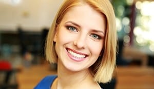 Woman with beautiful smile thanks to cosmetic dentistry