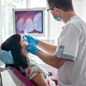 Dentist and patient looking at intraoral images