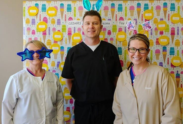 Doctor Shaffer and two dental team members