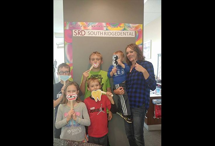 Kids posing in dental office