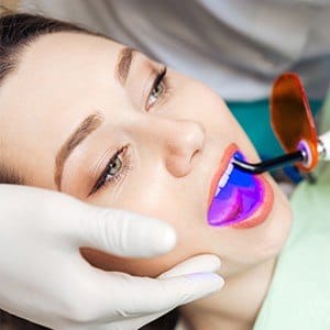 Patient receiving dental bonding treatment