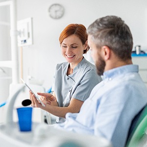 Lincoln cosmetic dentist explaining treatment to patient