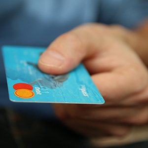 Man holding debit card