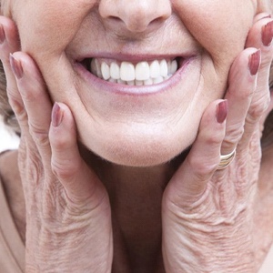close-up of a woman smiling with her dentures