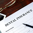 Dental insurance paperwork for paying for emergency dentistry treatment