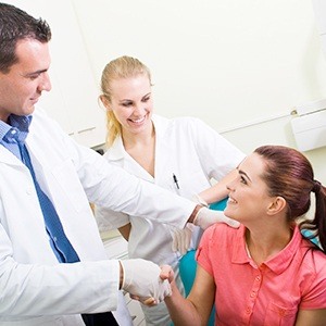 Lincoln emergency dentist shaking hands with his patient