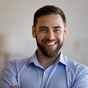 Man smiling after successful tooth extraction in Lincoln, NE