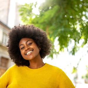 Person smiling outdoors