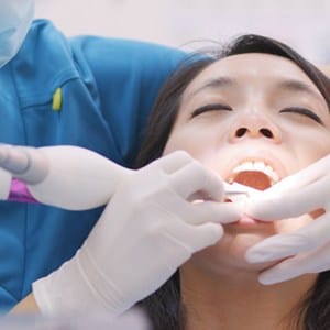 Dental patient receiving tooth colored filling