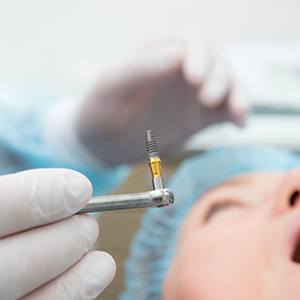 A person getting dental implant surgery