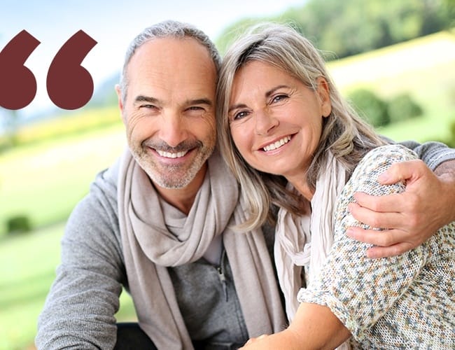 Smiling older man and woman outdoors