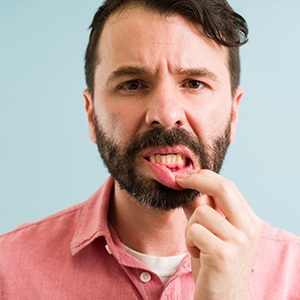 A man showing his gums