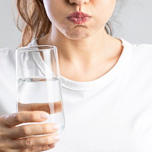 A woman gargling saltwater