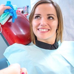 Woman shaking hands with sedation dentist in Lincoln