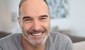 Older man with healthy smile after restorative dentistry