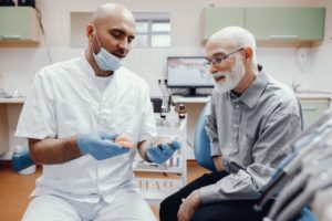 dentist talking to adult patient