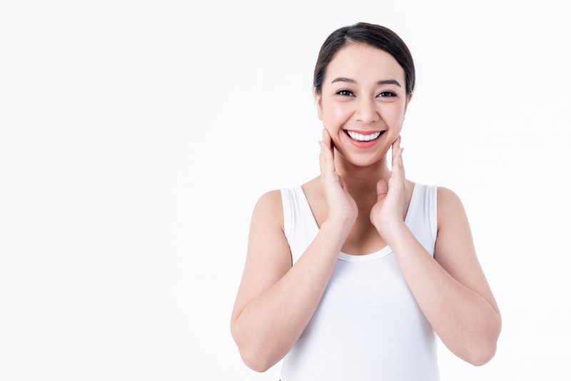 woman smiling about the facts about veneers in Lincoln