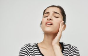 young woman with jaw pain