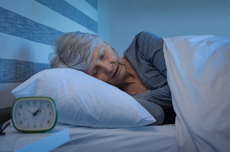 Patient sleeping with their dentures